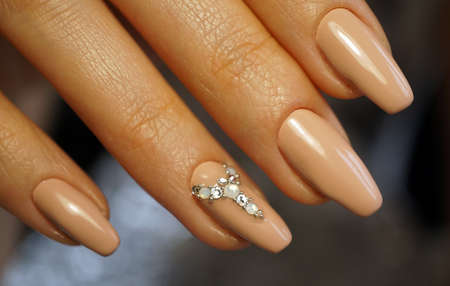 Awesome nails and beautiful clean manicure. Nails are natural. Manicure is made using nails drill machine.の写真素材