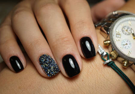 Beautiful bright natural nails with perfect clean manicure. Nail drill machine and cuticle nipper are used simultaneously to make such a clean manicure.の写真素材