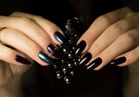 The beauty of the natural nails. Perfect clean manicure for the bright people. Nail drill machine and cuticle nipper are used simultaneously to make such a clean manicure.の写真素材