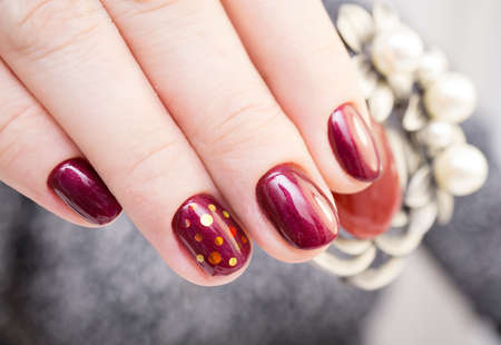 Perfect manicure and natural nails. Attractive modern nail art design. Gel polish applied.の写真素材