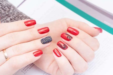 Amazing manicure and natural nails with gel polish. Attractive modern nail art design.の写真素材