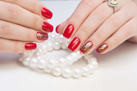 Amazing manicure and natural nails with gel polish. Attractive modern nail art design.の写真素材