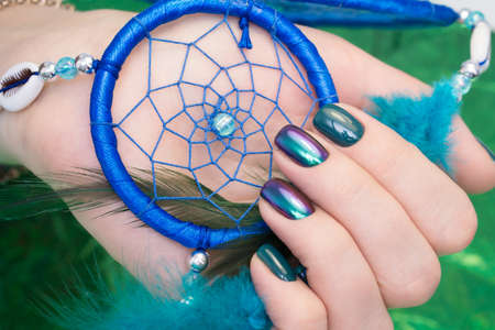 Amazing manicure and natural nails with gel polish. Attractive modern nail art design.の写真素材