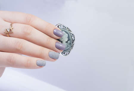 Beautiful hands and natural nails, ideal clean manicure. Decorated with stylish elementsの写真素材