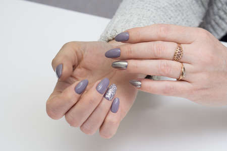 Beautiful woman's hands. Natural nails and manicure. Spa procedure.の写真素材