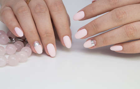 Beautiful woman's hands. Natural nails and manicure. Spa procedure.の写真素材