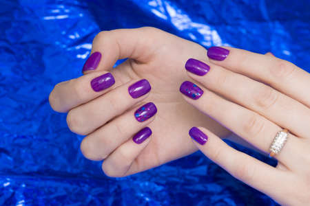 Beautiful woman's hands. Natural nails and manicure. Spa procedure.の写真素材