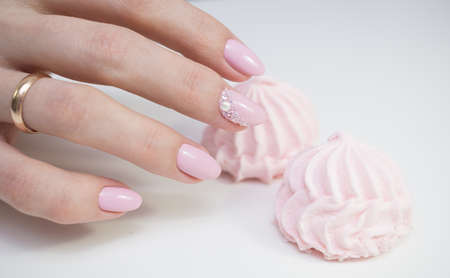 Beautiful hands with stylish manicure. Women have natural nails.の写真素材