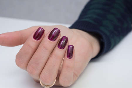 Beautiful woman's hands. Natural nails and manicure. Spa procedure.の写真素材