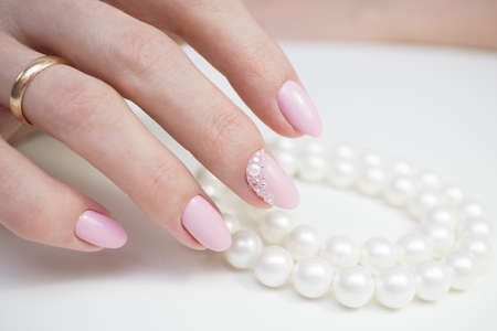 Beautiful hands with stylish manicure. Women have natural nails.の写真素材