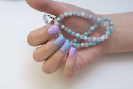 Attractive women's hands. Natural nails with beautiful manicure.の写真素材
