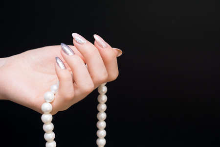 Hands with beautiful manicure. Natural nails with gel polishの写真素材