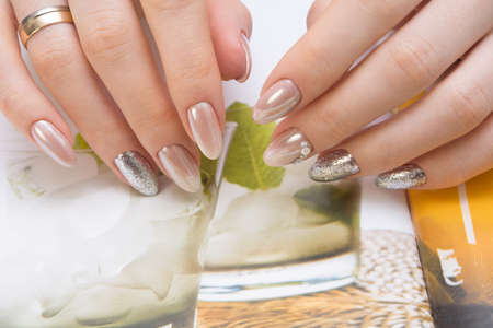 Hands with beautiful manicure. Natural nails with gel polishの写真素材