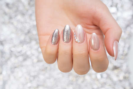 Hands with beautiful manicure. Natural nails with gel polishの写真素材