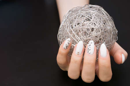 Beautiful manicure and nail art. Natural nails and gel polish.の写真素材
