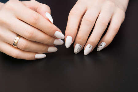 Beautiful manicure and nail art. Natural nails and gel polish.の写真素材