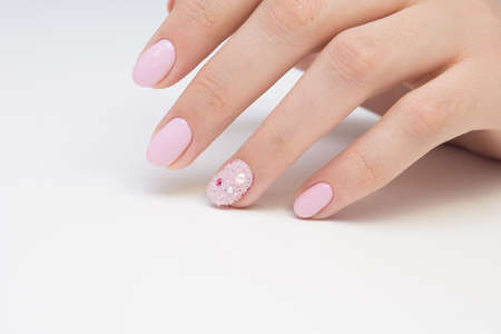 Beautiful manicure and nail art. Natural nails and gel polish.の写真素材