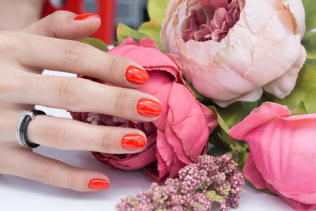 Beautiful manicure and nail art. Natural nails and gel polish.の写真素材
