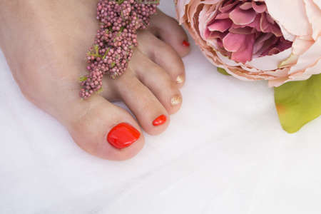 Woman's foot with gel polish applied. Natural nails.の写真素材