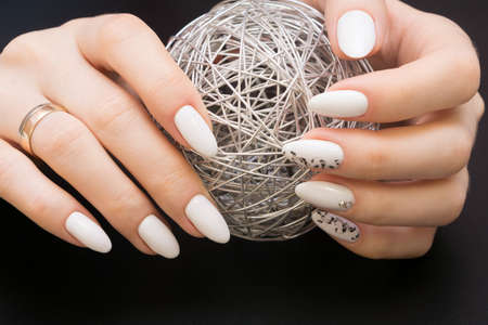 Beautiful manicure and nail art. Natural nails and gel polish.の写真素材