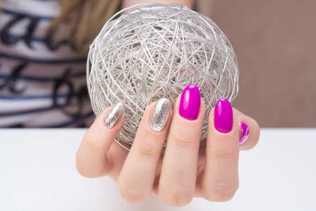 Beautiful manicure and nail art. Natural nails and gel polish.の写真素材