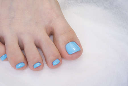 Women's foot and clean pedicure, natural nails. Gel polish applied.の写真素材