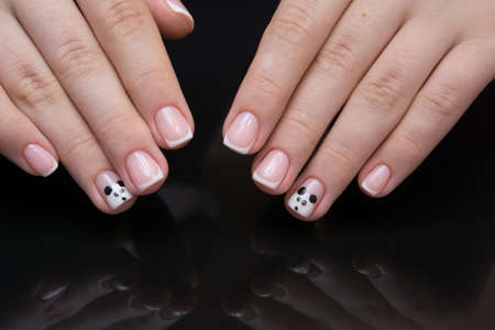 Beautiful natural nails. Clean manicure and nail art. Women's handsの写真素材