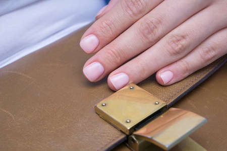Beautiful natural nails. Clean manicure and nail art. Women's handsの写真素材