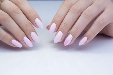 Beautiful natural nails. Clean manicure and nail art. Women's handsの写真素材