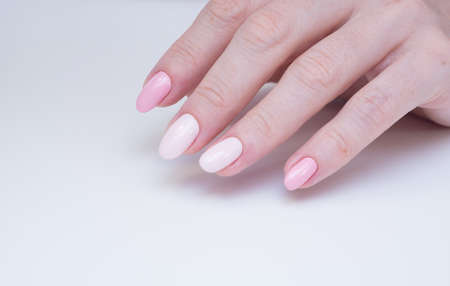 Beautiful natural nails. Clean manicure and nail art. Women's handsの写真素材