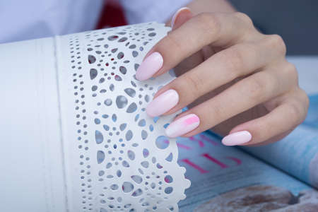 Beautiful natural nails. Clean manicure and nail art. Women's handsの写真素材