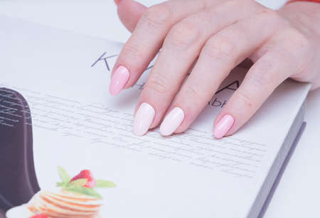 Beautiful natural nails. Clean manicure and nail art. Women's handsの写真素材