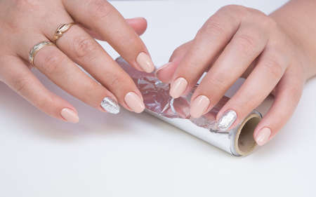 Amazing natural nails. Women's hands with clean manicure. Gel polish applied.の写真素材