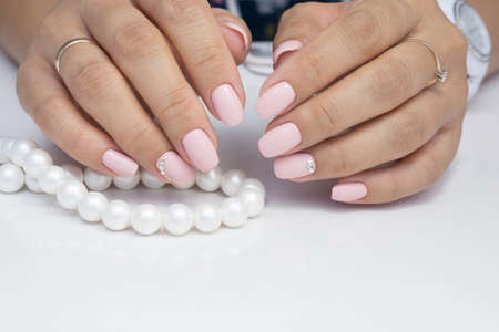 Amazing natural nails. Women's hands with clean manicure. Gel polish applied.の写真素材