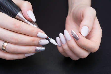 Amazing natural nails. Women's hands with clean manicure. Gel polish applied.の写真素材