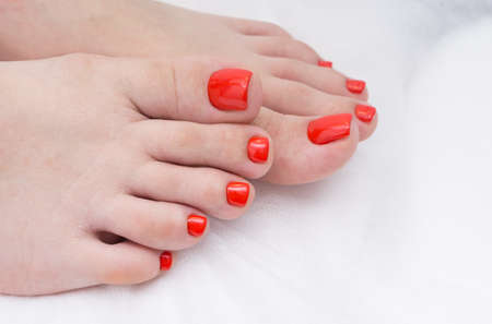 Women's feet with amazing pedicure. Nails with gel polish applied.の写真素材