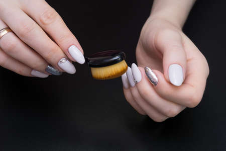 Amazing natural nails. Women's hands with clean manicure. Gel polish applied.の写真素材