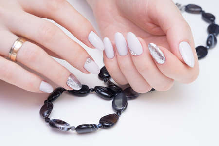 Amazing natural nails. Women's hands with clean manicure. Gel polish applied.の写真素材