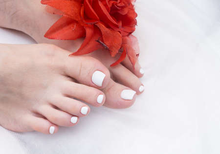 Women's feet with amazing pedicure. Nails with gel polish applied.の写真素材