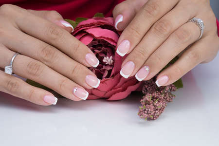Natural nails with gel polish applied. Ideal manicure and women's hands.の写真素材