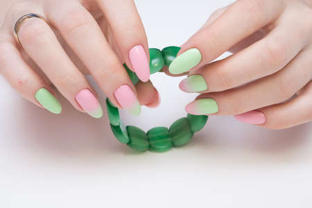 Natural nails with gel polish applied. Ideal manicure and women's hands.の写真素材