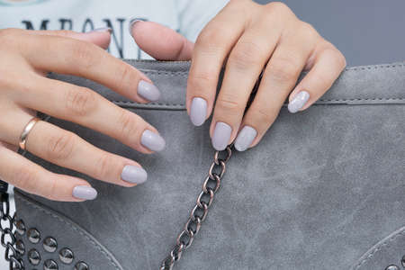 Natural nails with gel polish applied. Ideal manicure and women's hands.の写真素材