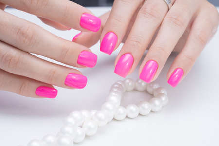 Natural nails with gel polish applied. Ideal manicure and women's hands.の写真素材