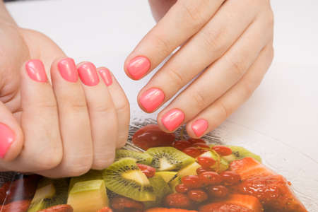 Natural nails with gel polish applied. Ideal manicure and women's hands.の写真素材