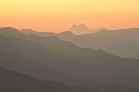 Ushba in the morning sun. Caucasus mountain silhouette as a background with copyspaceの写真素材
