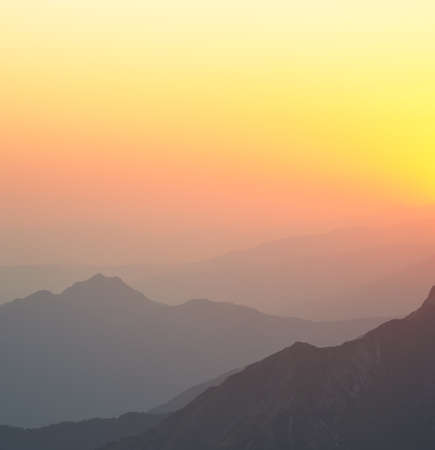 Yellow mountain silhouette background with copyspace. High resolution panoramaの写真素材