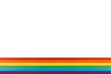 LGBT and pride background. Colored paper painted like an LGBT flag. It is located below on a white sheet of paper.の写真素材