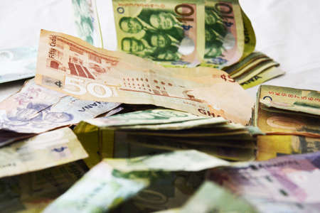 corruption - big amount of ghana money on bedの写真素材
