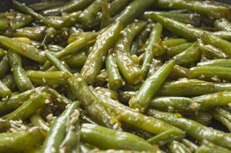 Fried green beans with garlic and sesame. Juicy food background (selective focus)の写真素材