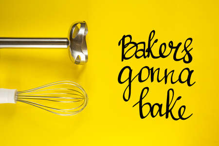 Bakers gonna bake, handwritten lettering. Chopper and whisk nozzles for blender device. Kitchen accessories on yellow background. Cooking and baking theme.の写真素材